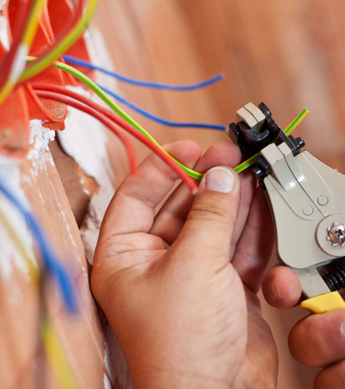 close up of a electrician working with a pincer covington la